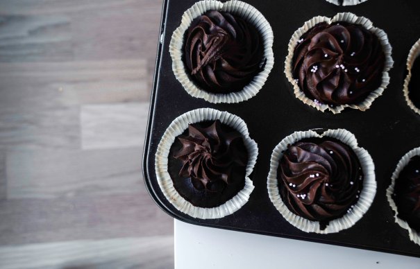Chocolate cupcakes on the edge of the table!